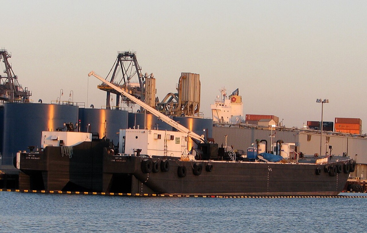  Aerial view of a port of Los Angeles container terminal with cranes and stacked boxes, the type of entry point where battery-material and chemical precursor cargo from China is assessed for duty 